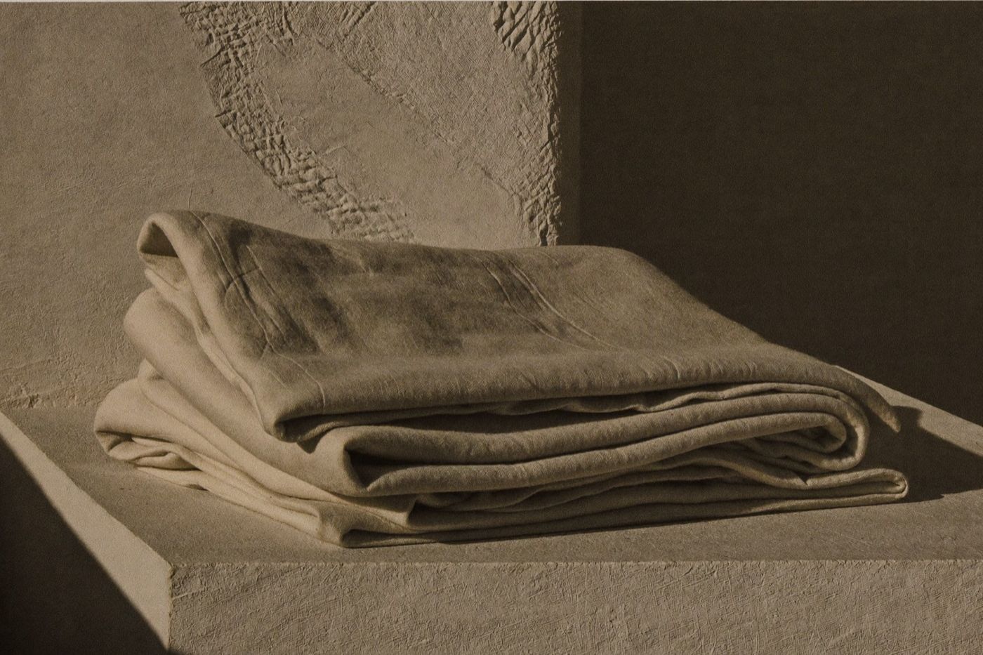 Folded linen cloth in hard directional light